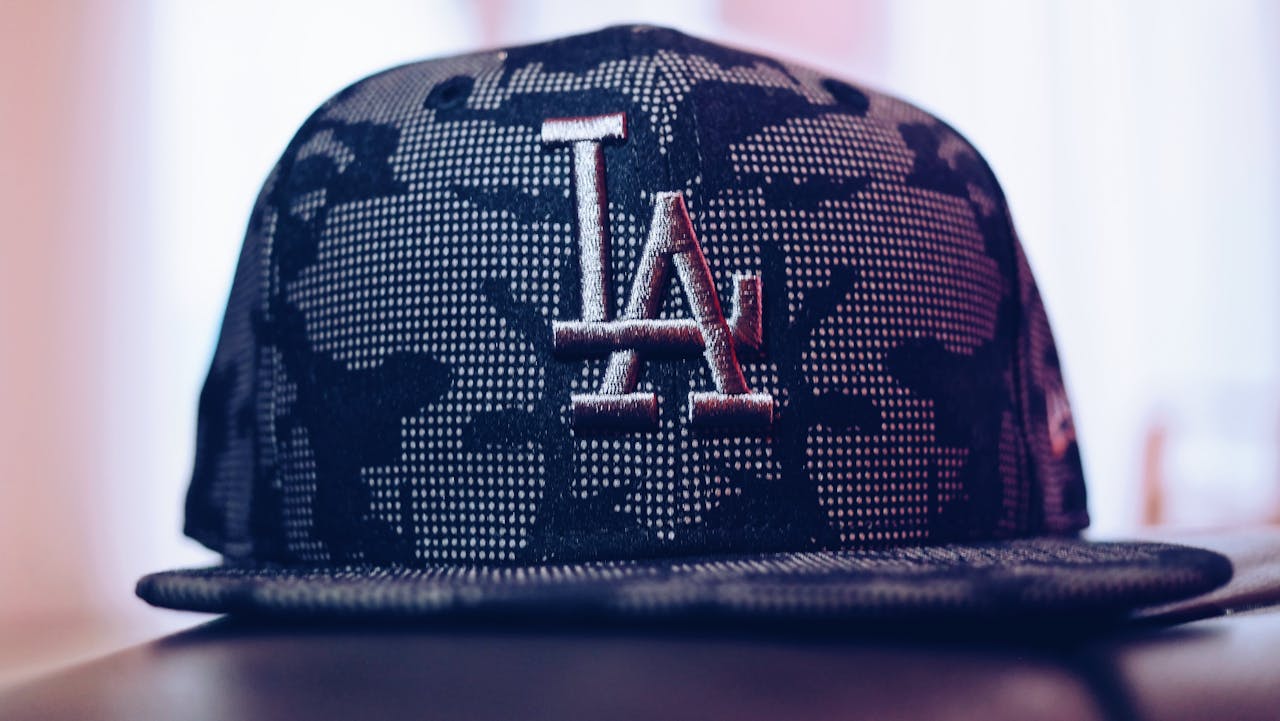 our-services-3 Close-up of a trendy Los Angeles baseball cap with a modern design indoors.